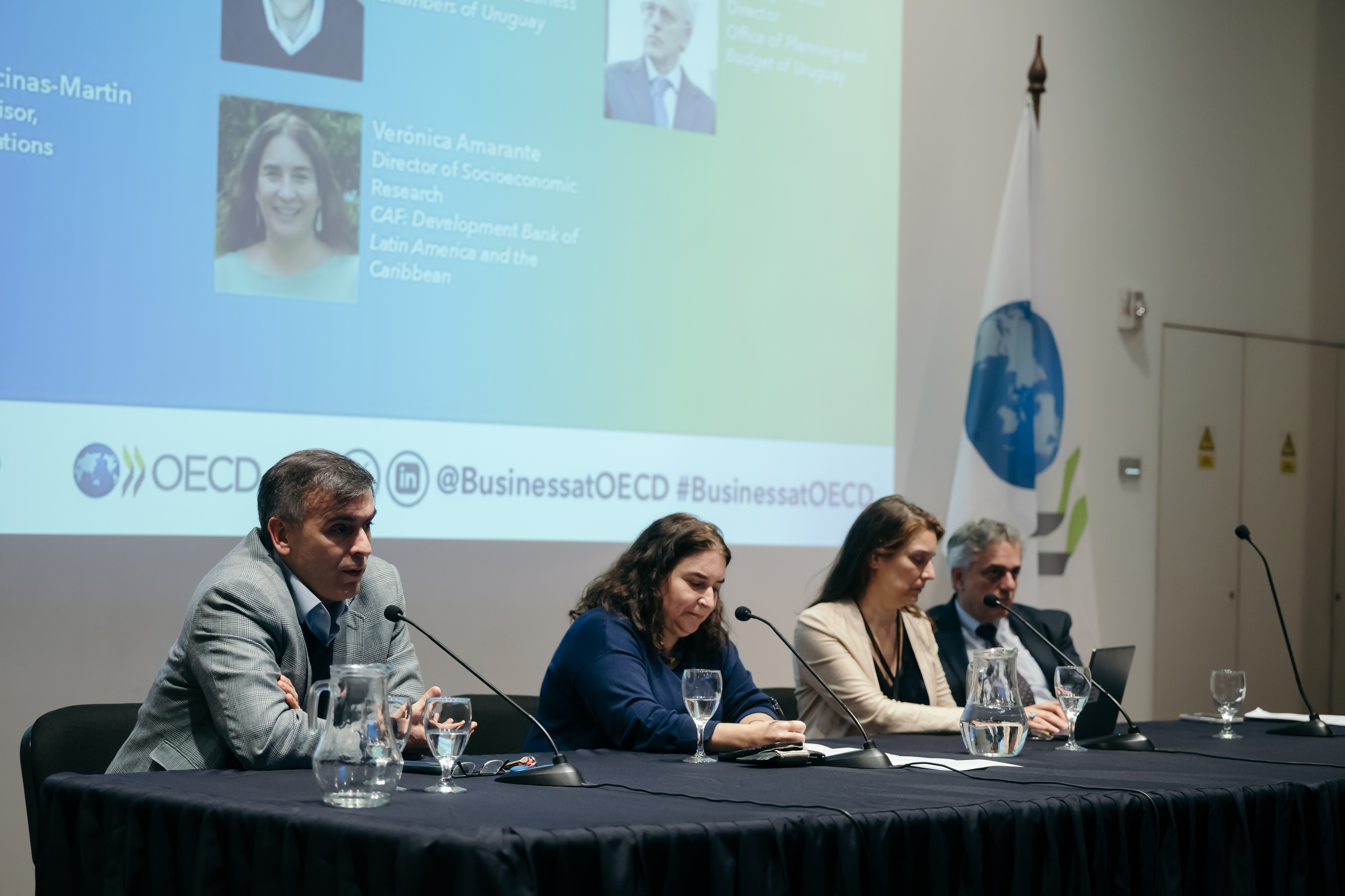 Left to right: On panel 3, Confederation of Buisness Chambers of Uruguay's Leonardo Loureiro, the OECD's Marta Encinas-Martin, CAF's Verónica Amarante, and the Office of Planning and Budget of Uruguay's Rodrigo Arim joined discussions.